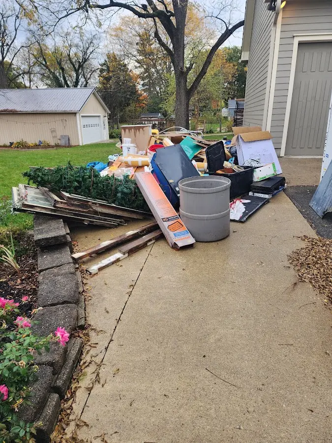 Dumpster being loaded with debris for Demolition Dumpster Rental in Willistown